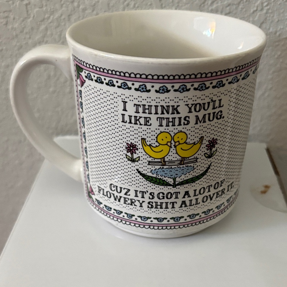 Quirky White Mug with Floral and Duck Design